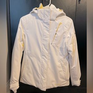 White and yellow women’s Spyder ski jacket.
